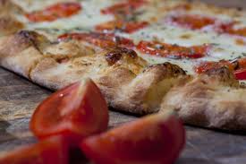 pizza crust with tomato slices